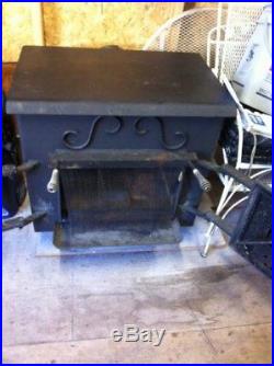 Older wood burning stove in good condition