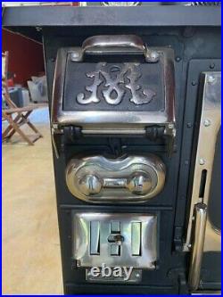 Re-plated and completely refurbished vintage Majestic Wood Stove