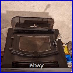 United States Stove Company Freestanding Black Metal Woodstove with Viewing Window