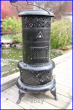 Vintage Perfection Heater/Parlor Stove with insert Nice