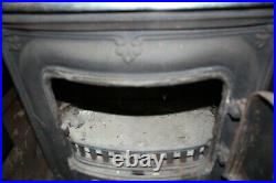 Vintage cast iron wood burning parlor stove, fireplace with cook top good shape