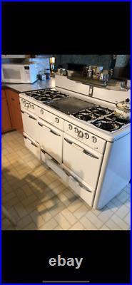 Vintage roper gas stove with 8 cast iron burners oven and warming drawer
